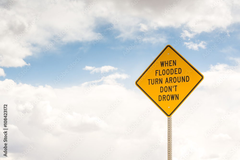 Naklejka premium When flooded turn around. Road sign