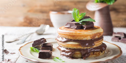 Homemade pancakes with chocolate spread. photo