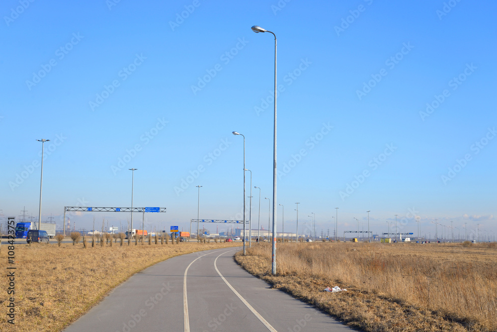 Bike path on the outskirts of St. Petersburg at sunny day, Russia.