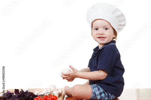 Little boy cook pizza. Clos...