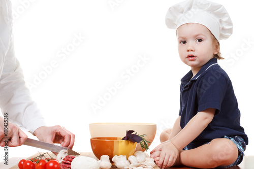 Little boy cook pizza. Clos...