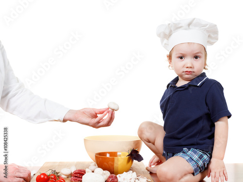 Little boy cook pizza. Clos...