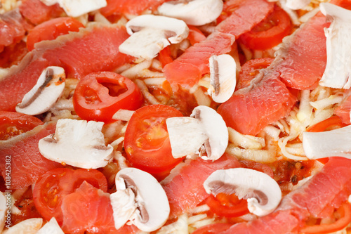 Cooking homemade pizza with...