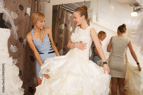 Two Girlfriends In Bridal Boutique