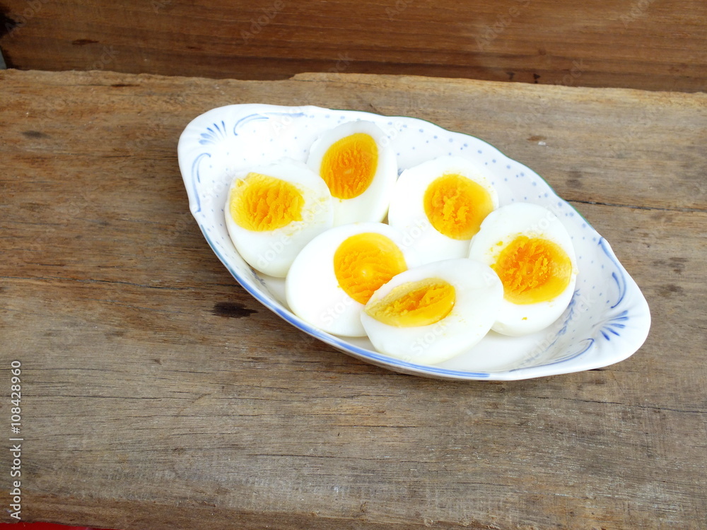 boiled eggs on plate and wooden background close up boiled eggs on plate and wooden background close up