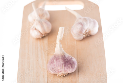 Fresh garlic on wood white background