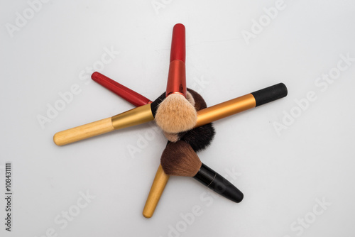 Set of decorative brush cosmetics on white background