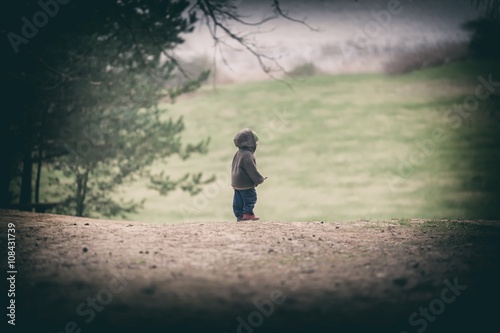 Young boy playing outdoor at spring day
