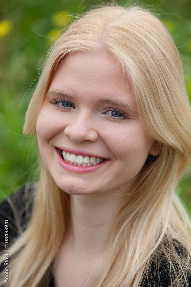 Naklejka premium Happy blonde girl outside