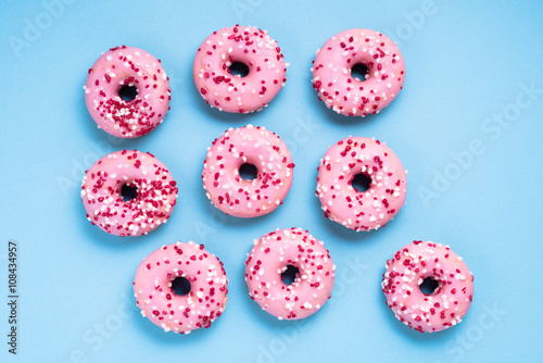 Pink donuts on blue background