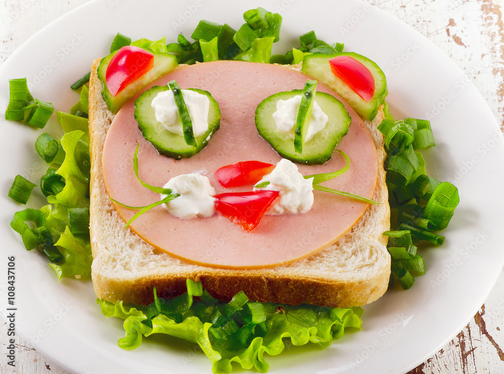 Breakfast with smiling toast and fresh vegetables. Top view Breakfast with smiling toast and fresh vegetables. Top view