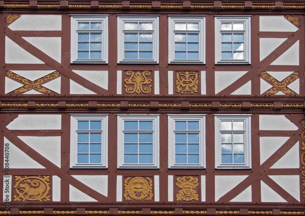 old half timbered house facade with ornaments in the open air museum Hessenpark, Neu Anspach, Germany