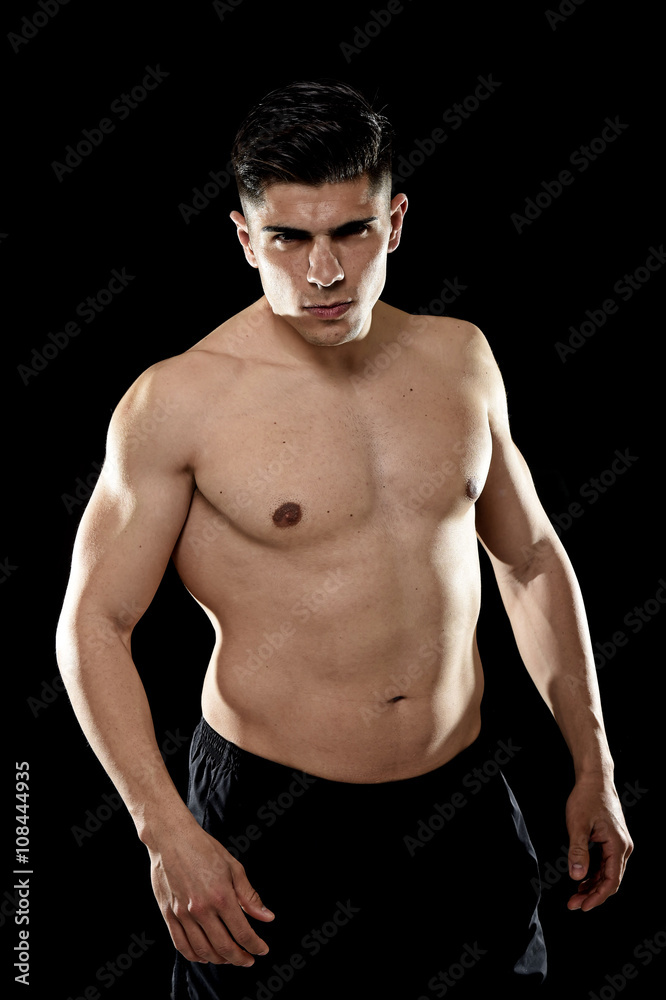 Fototapeta premium handsome sport man posing with strong naked torso looking cool defiant fit body concept
