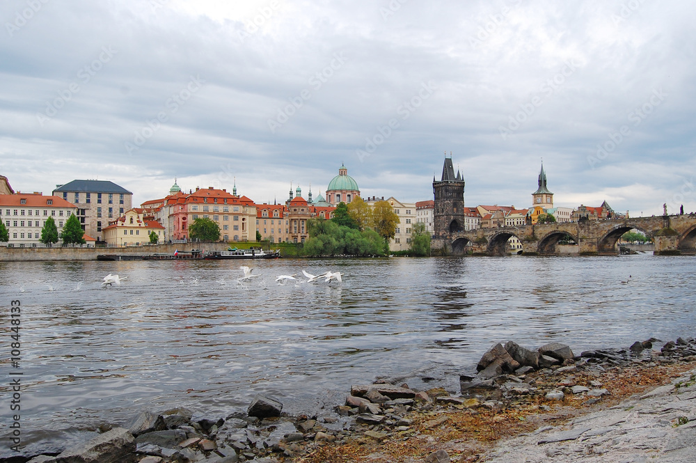 Fototapeta premium Prague. Old town. Spring.River Vltava. View from the bank to Charles Bridge.