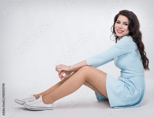 Teenager girl in a blue dress