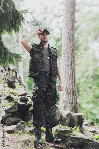 young soldier or ranger in forest