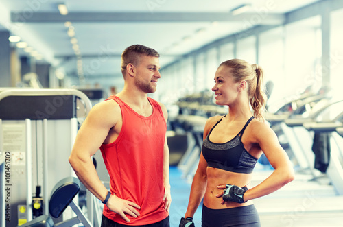 smiling man and woman talking in gym © Syda Productions