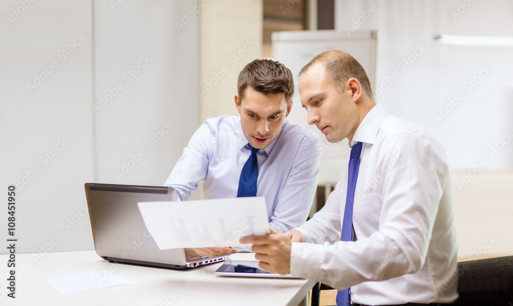 two businessmen having discussion in office