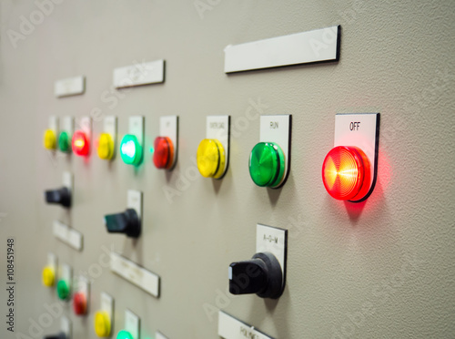 Group of status indicator light and selective switch of Auto-Manual on electrical control panel with blank name tag.Selective focus on OFF status light