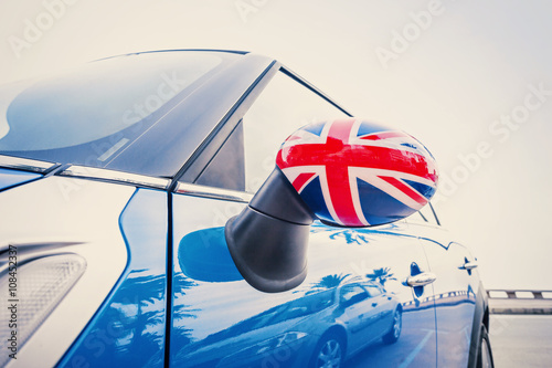 Close up on mirror of a car with the flag of Great Britain