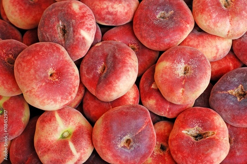 Peach fruits .Flat peaches background.