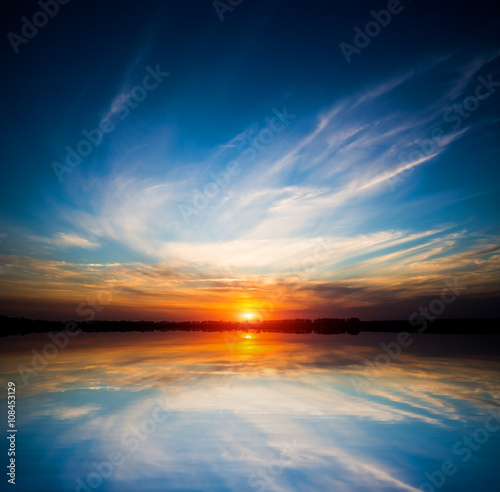 nice sunset sky over water © Pavlo Klymenko