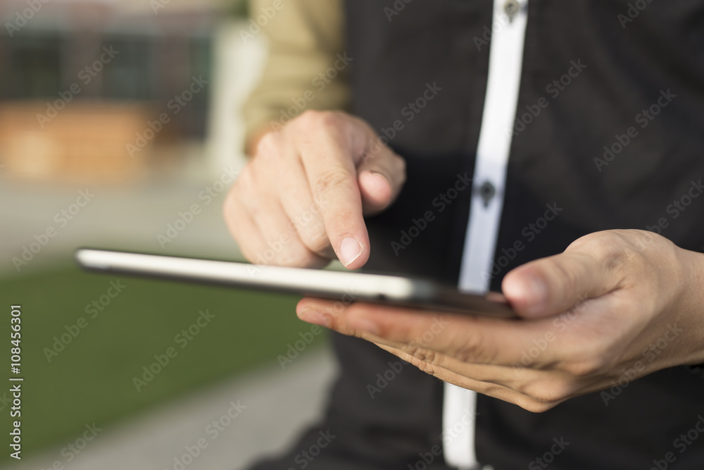 Man Typing a Tablet Man Typing a Tablet