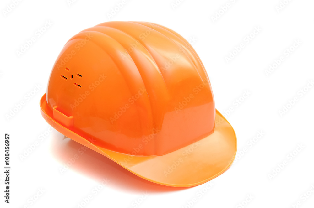 Fototapeta premium Builder plastic helmet orange color on white background. Isolated. 