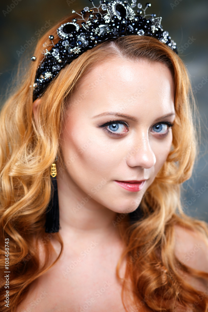 Elegant young woman with perfect makeup and hair style wearing diadem. Beauty fashion portrait with accessories