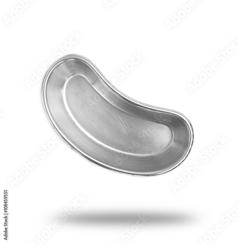 Stainless steel kidney-shaped bowl isolated on white background. photo