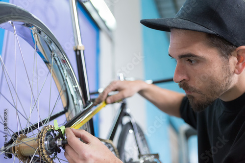 Close-up of bearded man taking measurements