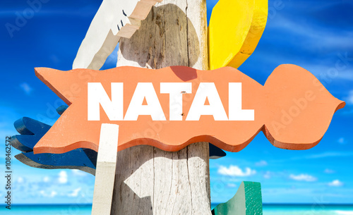 Natal signpost with beach background