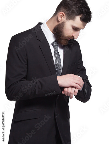 Close up portrait of a young bearded businessman on white background