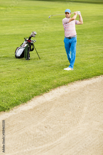 Man playing golf