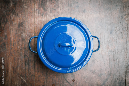 blue of cooking pot on wooden background