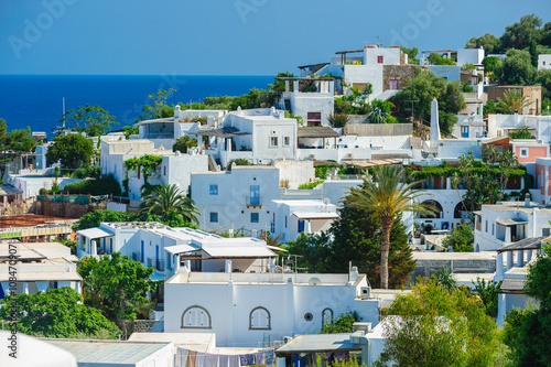 A view of Panarea island with typical white houses, Italy. photo