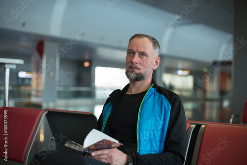 Man waiting flight at the airport © sanechka