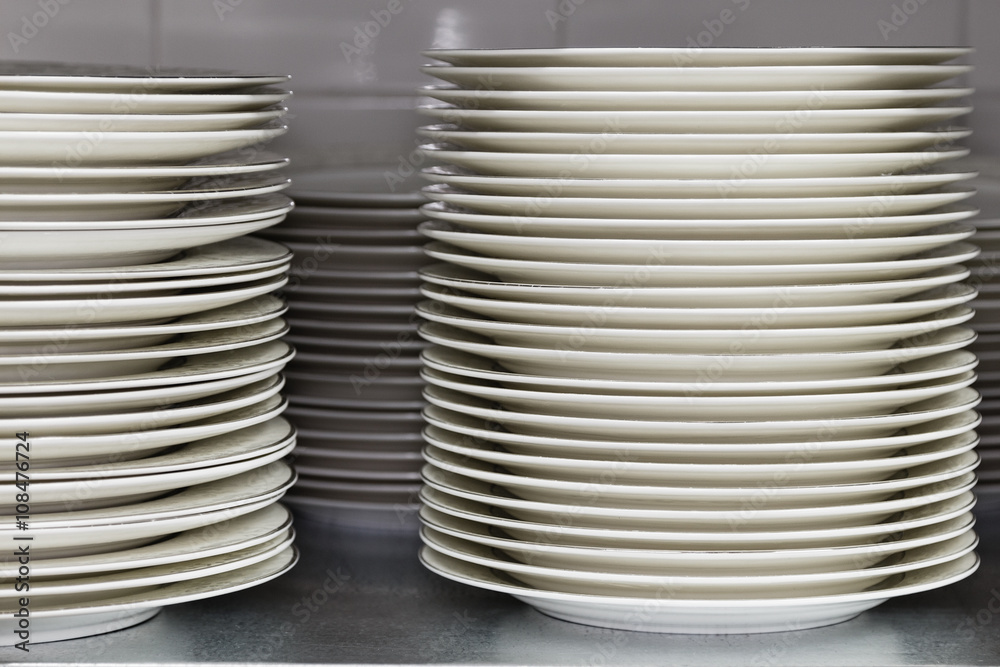 Restaurant utensils. Stack of plates Restaurant utensils. Stack of plates
