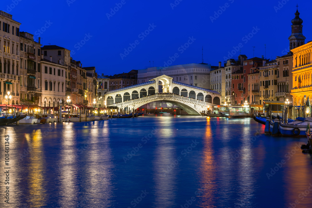 Night view of Rialto bridge and Grand Canal in Venice. Italy