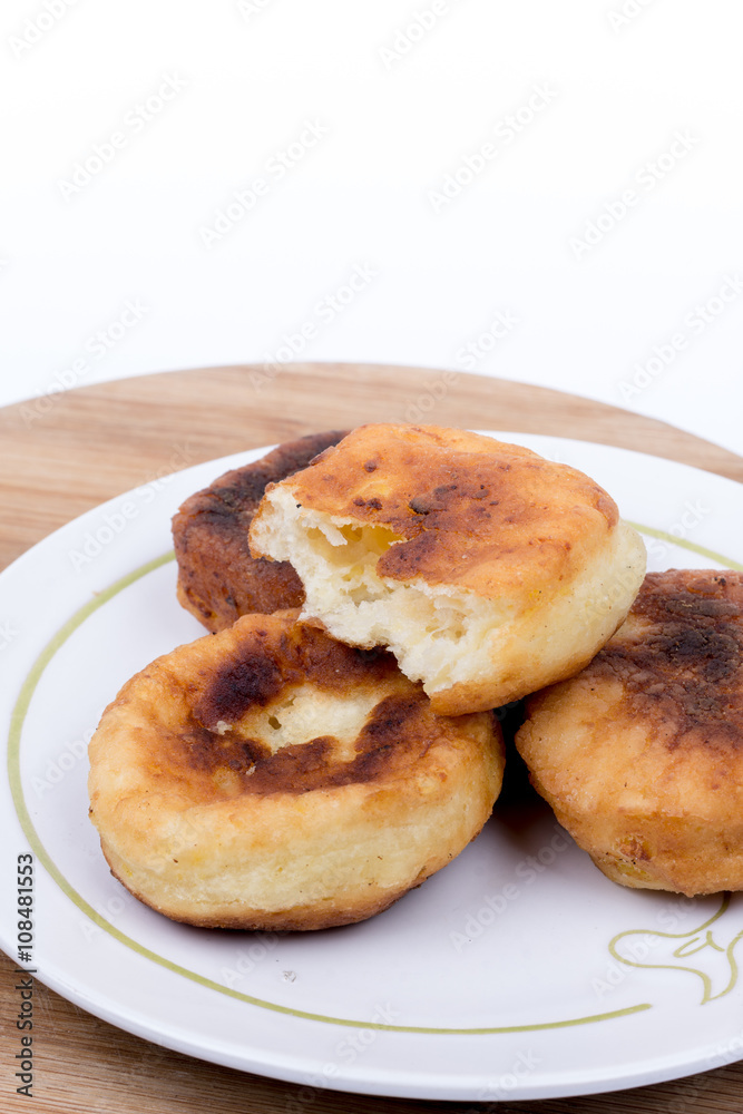 Homemade donuts with copy space over white background Homemade donuts with copy space over white background