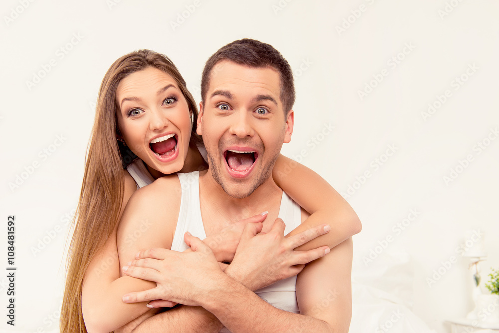 Close up portrait of man and woman screaming with funny faces Close up portrait of man and woman screaming with funny faces