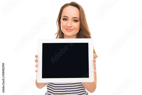 Portrait of attractive woman demonstrating black screen of tabl