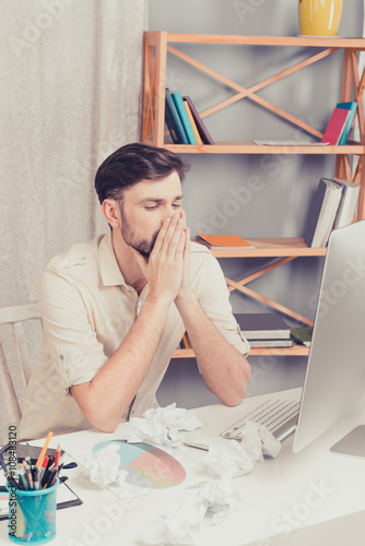 Portrait of minded man thinking about his hard task photo