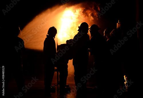 The firemen While practicing a fire at night.