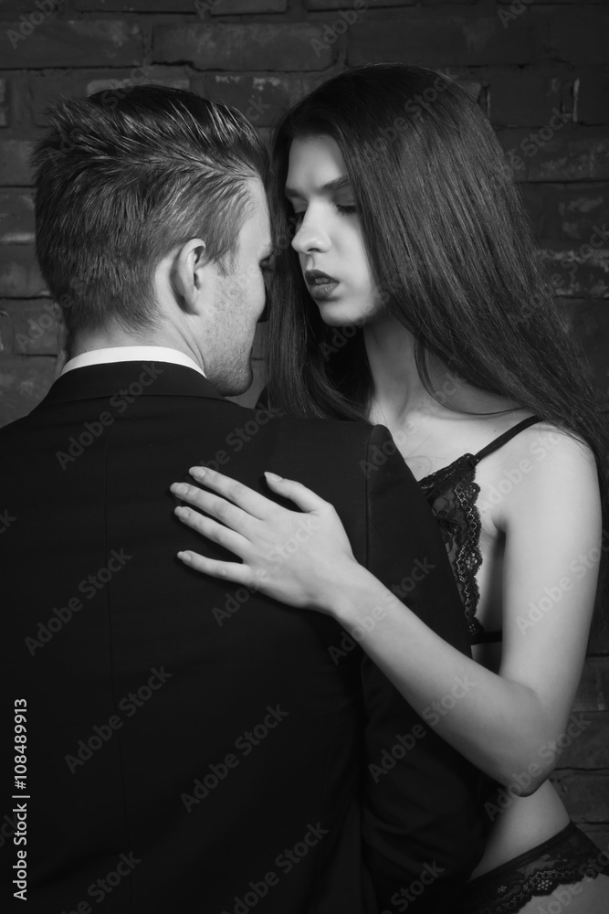 Beautiful young woman kissing her boyfriend