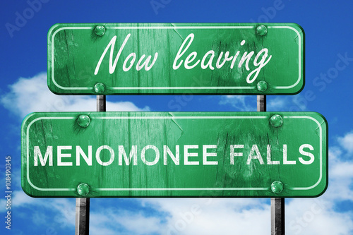 Leaving menomonee falls, green vintage road sign with rough lett photo