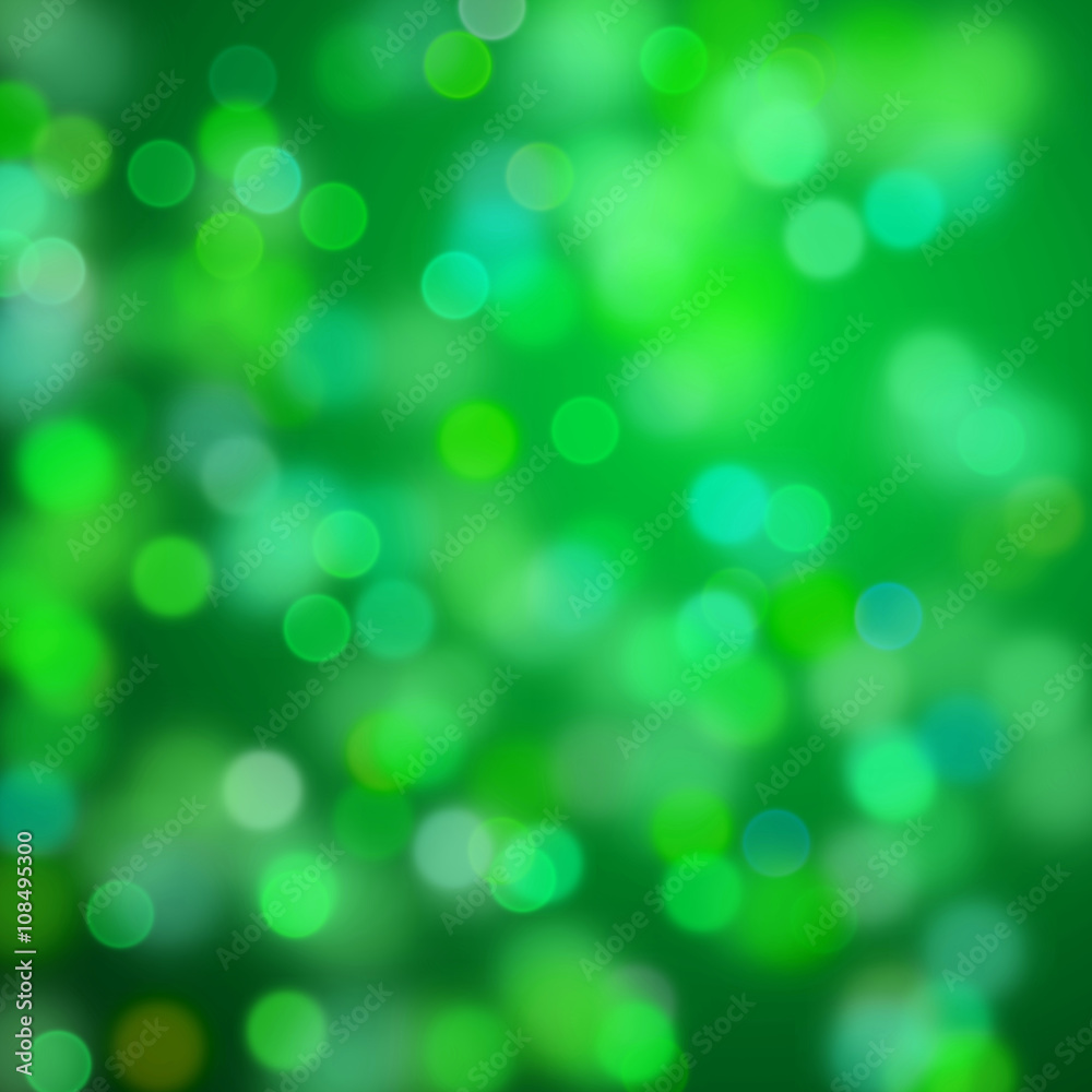 warm bokeh effects in shades of green and blue in front of a dark background