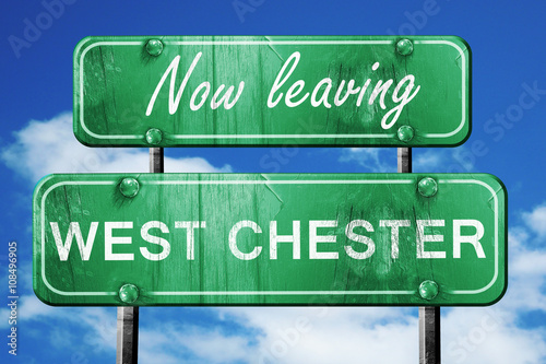 Leaving west chester, green vintage road sign with rough letteri photo