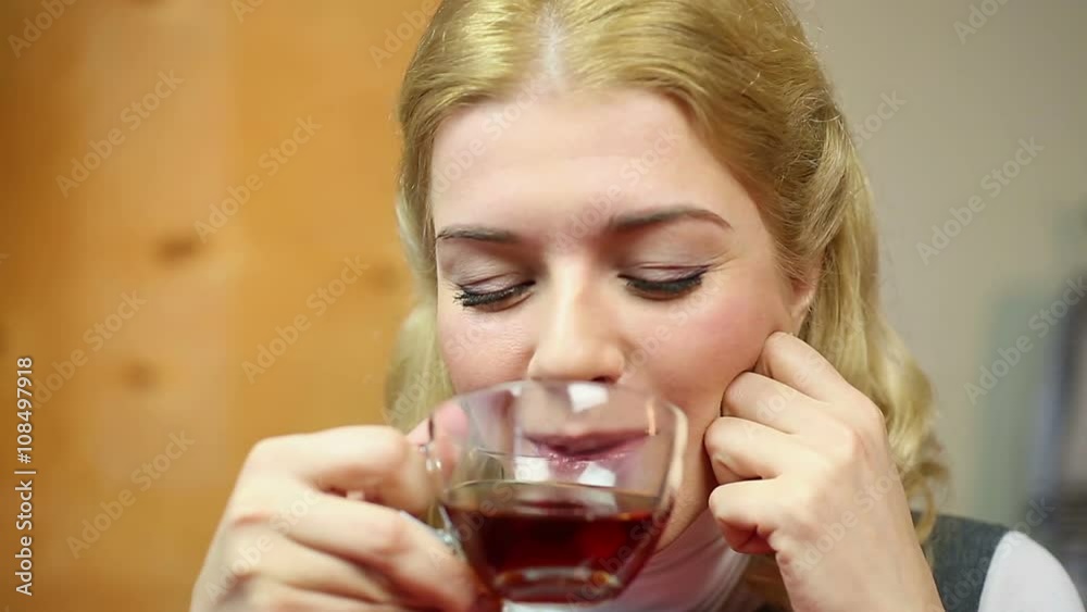 Blond woman looking into cam, smiling, flirting on a date with her boyfriend Blond woman looking into cam, smiling, flirting on a date with her boyfriend