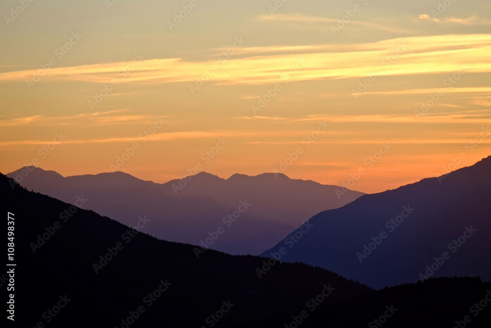 Sunrise with Clouds over Mountains. 
California, United States. 